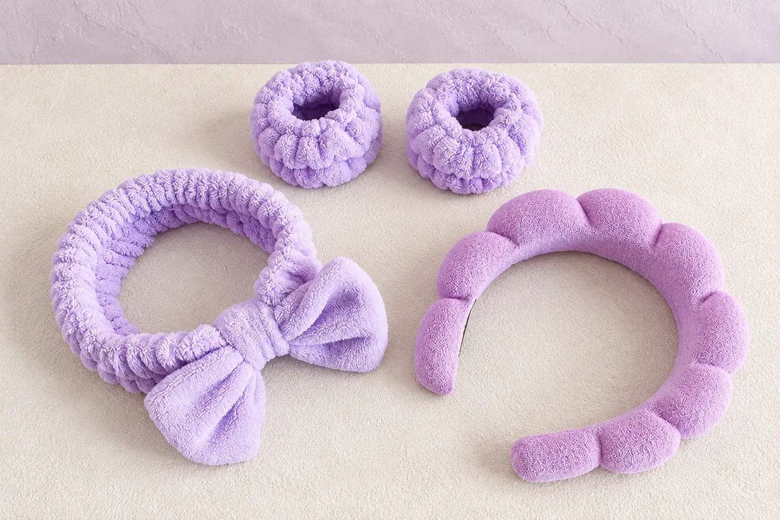Lavender makeup headbands and wristbands on a continuous studio background