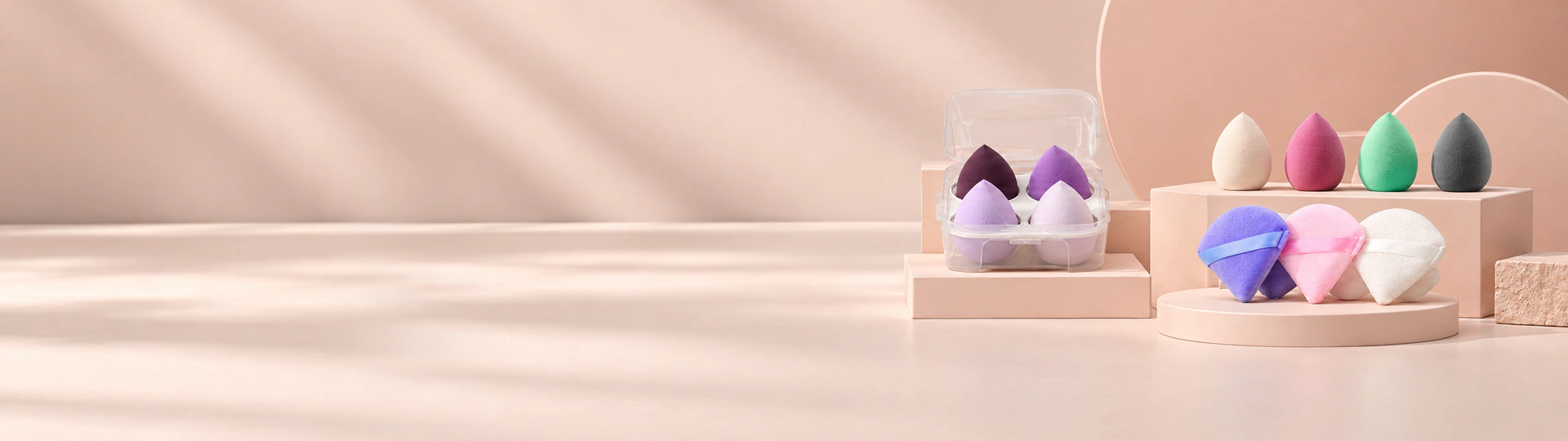 GAMBUR makeup sponges and pointed makeup puffs in a clear customization studio display